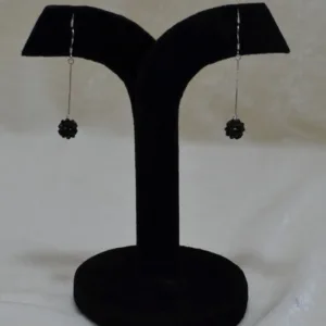 air of black cluster silver drop earrings on display stand