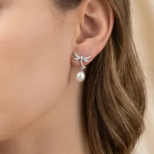 Dragonfly 925 silver drop earring worn on ear
