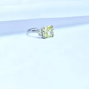 silver adjustable ring with pale yellow centre accent displayed on white background