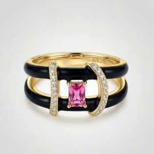 golden 925 silver ring with black geometric bands and pink centre accent