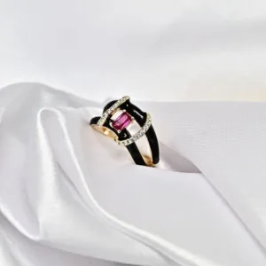 Noir Frame golden silver ring displayed on white satin background