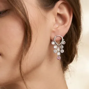 Pink cascade 925 silver drop earring worn on ear