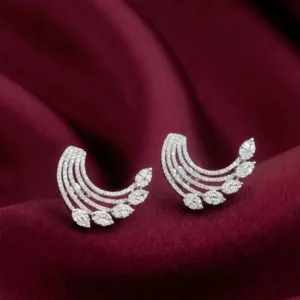 Pair of radiant crescent 925 silver earrings on burgundy fabric